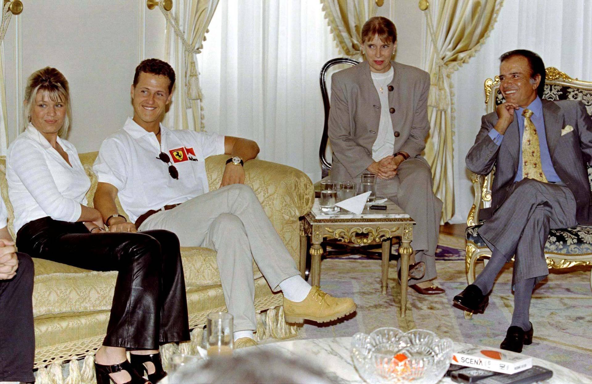 FILE PHOTO: Argentina's President Carlos Menem meets Ferrari's Michael Schumacher and his wife Corinna Betsch at the Olivos Presidential residence
