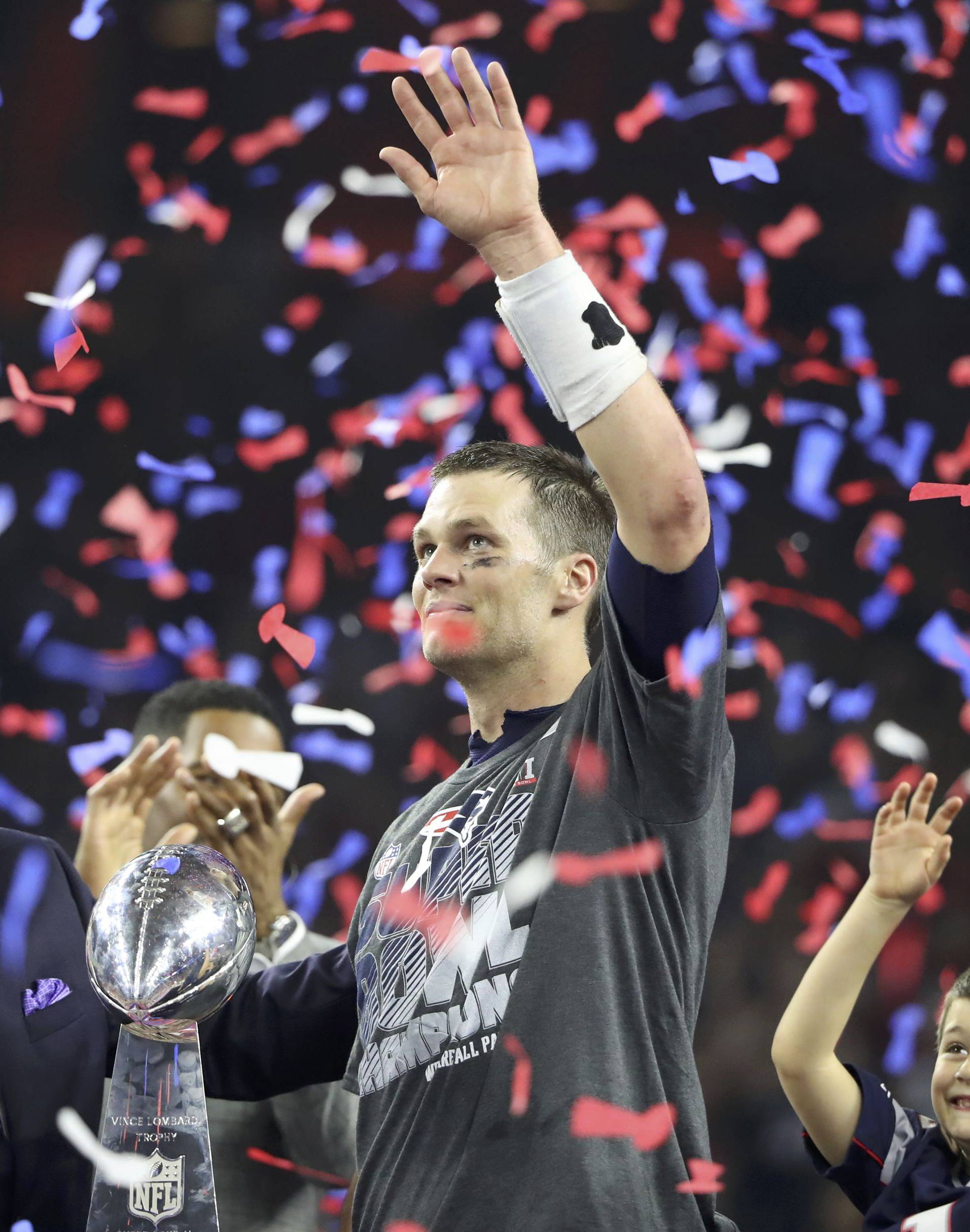 New England Patriots' quarterback Tom Brady holds the Vince Lombardi trophy after his team defeated the Atlanta Falcons to win Super Bowl LI in Houston