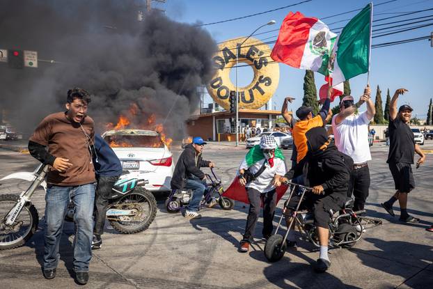 Standoff by protesters and law enforcement, following multiple detentions by ICE in Los Angeles County