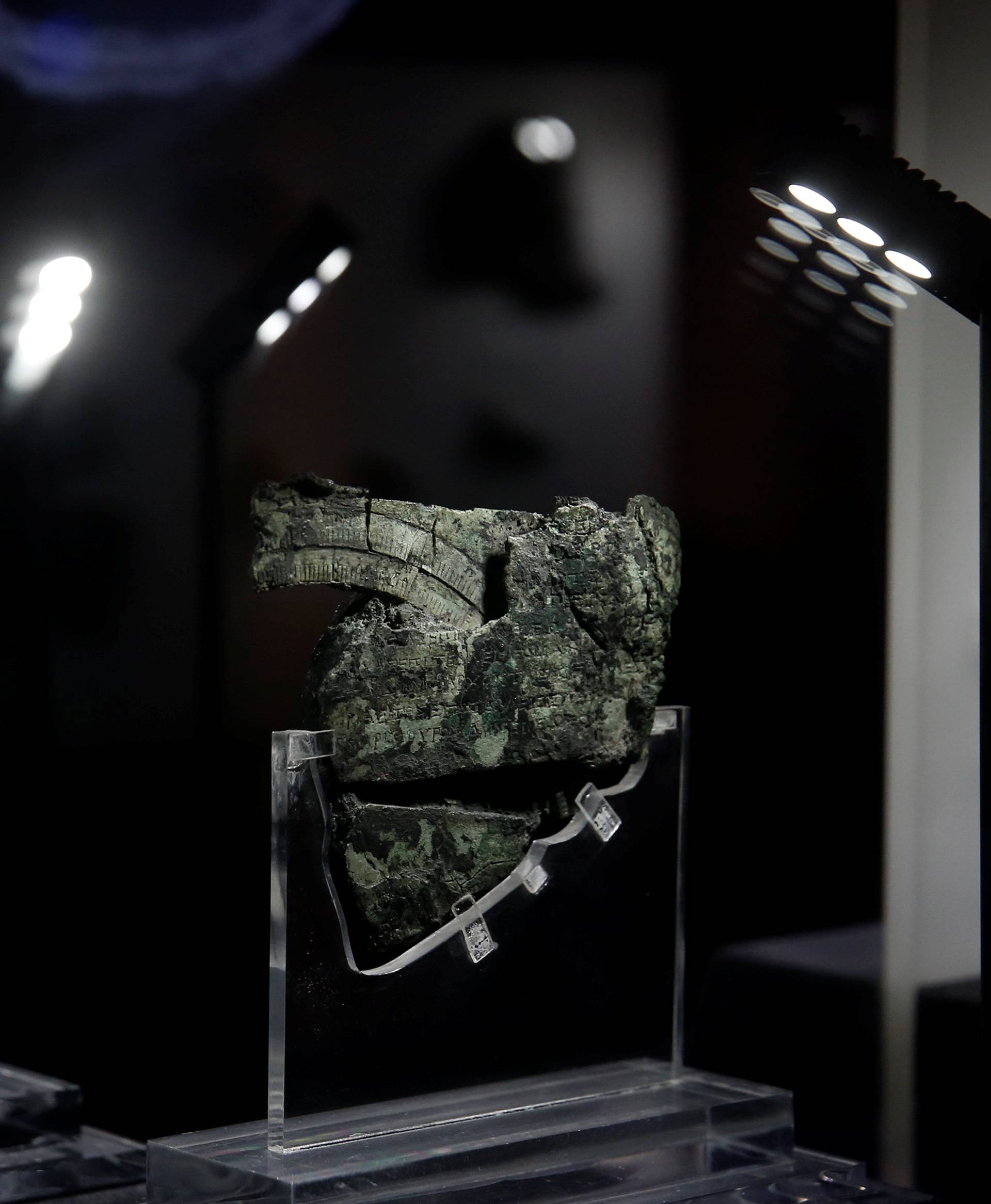 A fragment of the ancient Antikythera Mechanism is displayed at the National Archaeological Museum in Athens