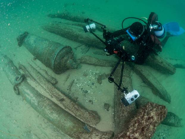 Divers are seen during the discovery of a centuries-old shipwreck, in Cascais