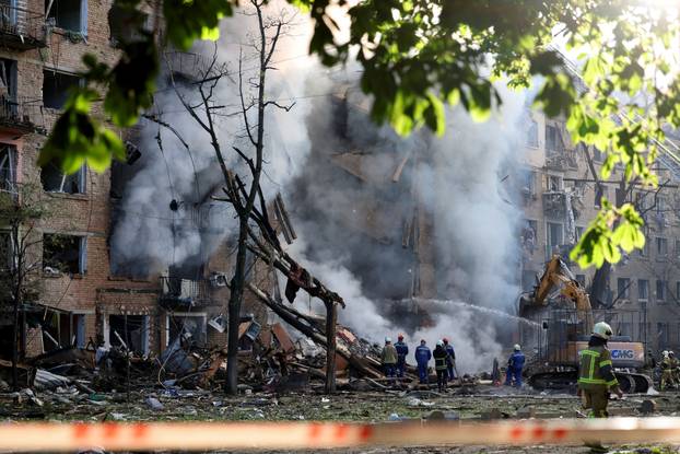 Site of an apartment building damaged during a Russian missile and drone strike, amid Russia's attack on Ukraine, in Kyiv