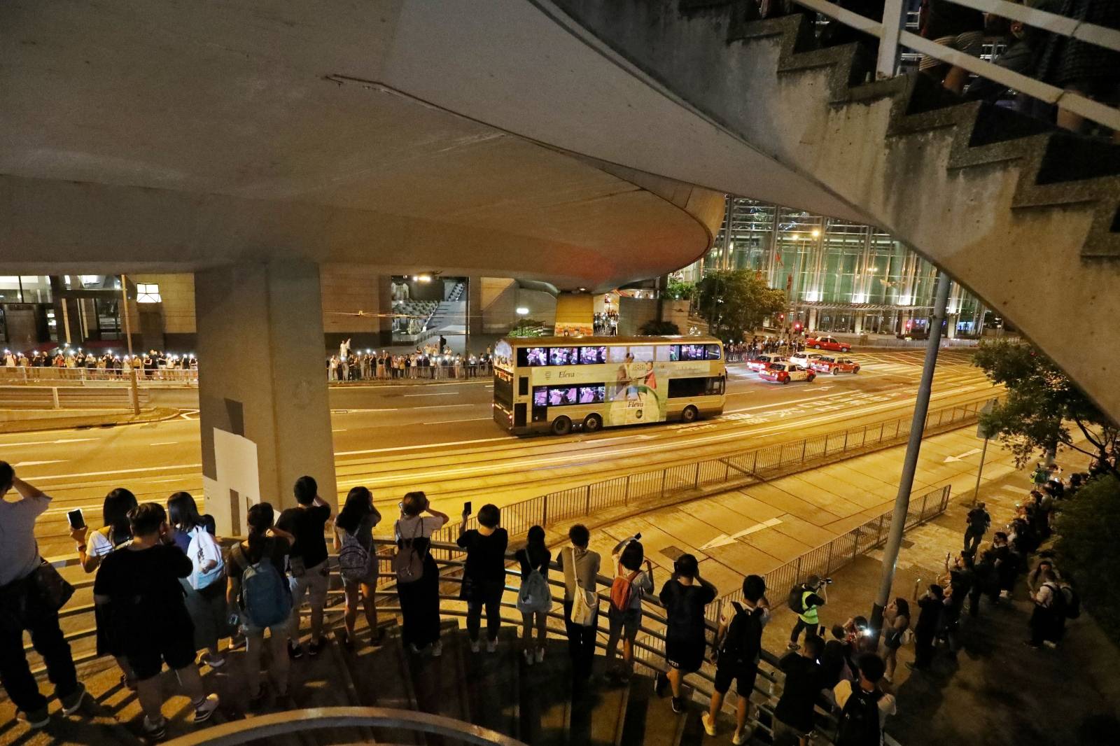 Protesters stand next to each other to form a human chain during a rally to call for political reforms in Hong Kong