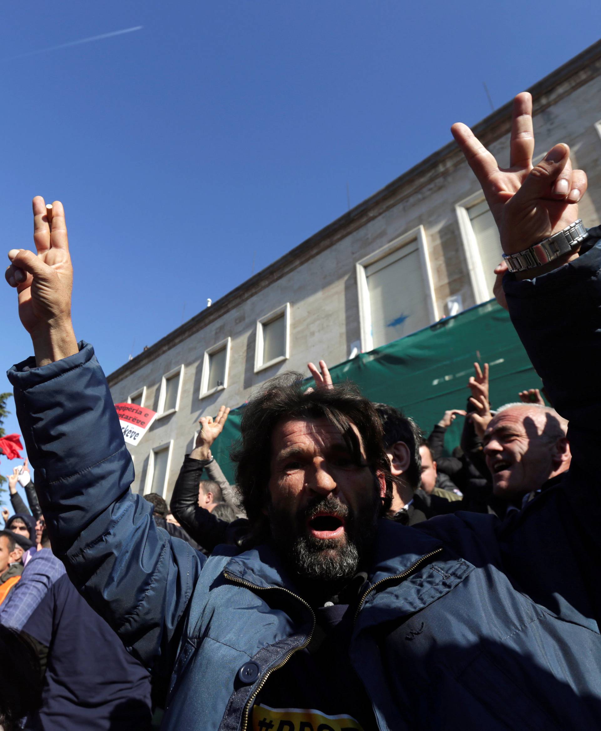 Supporters of the opposition party shout slogans during an anti-government protest in front of the office of Albanian Prime Minister Edi Rama in Tirana