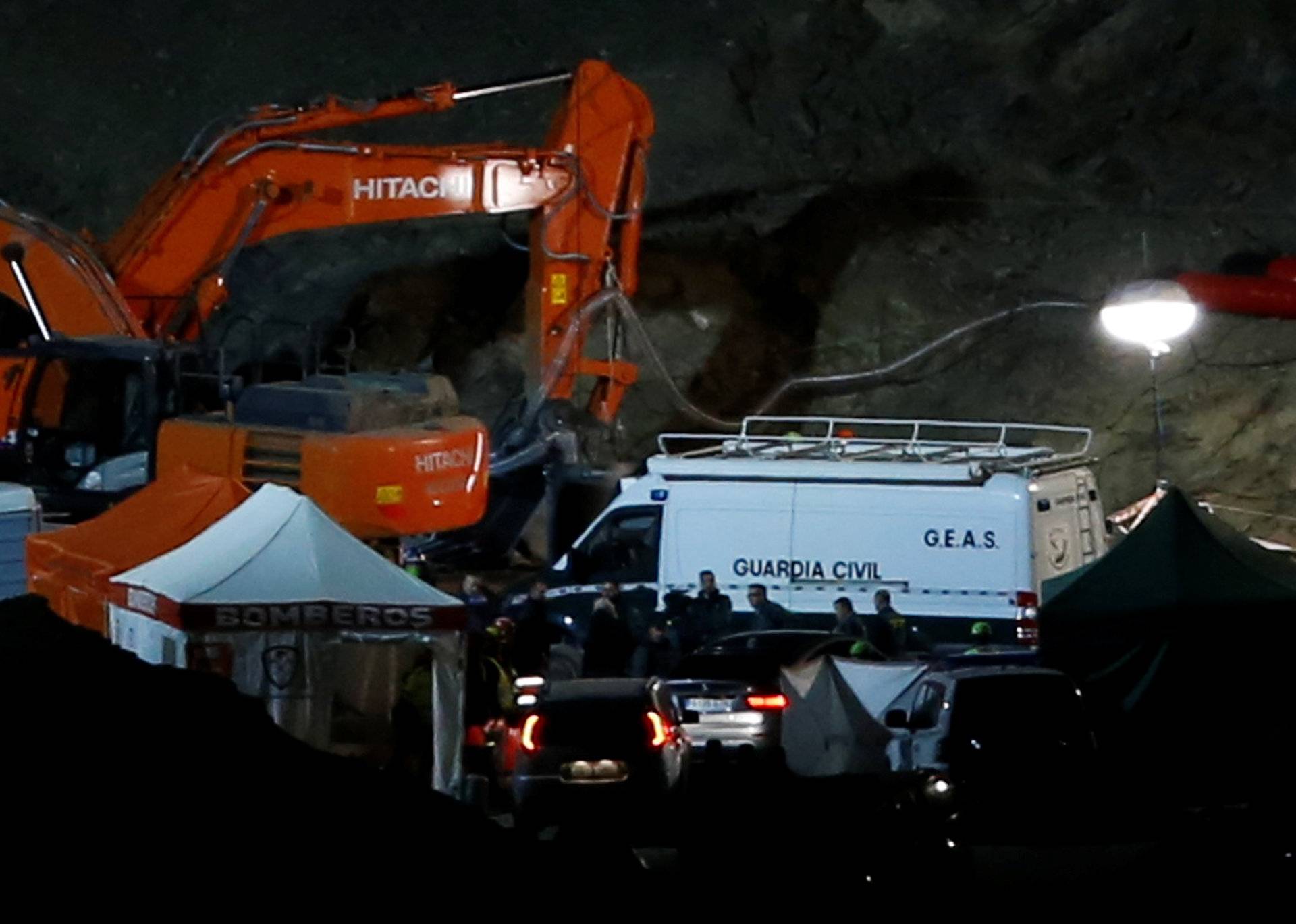 Spanish rescuers are seen after finding the dead body of Julen, a Spanish two-year-old boy who had fallen into a deep narrow well in Totalan, southern Spain