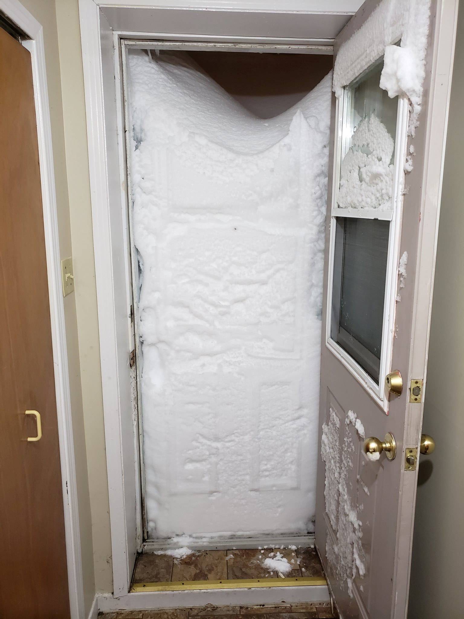 Snow blocks the entrance to an apartment in St Johns, Newfoundland