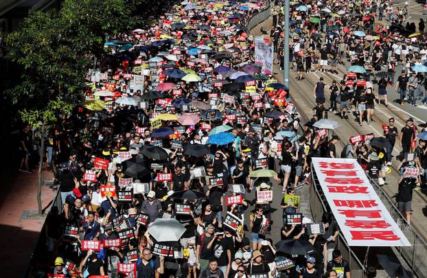 Anti-extradition bill protesters march during the anniversary of Hong Kong