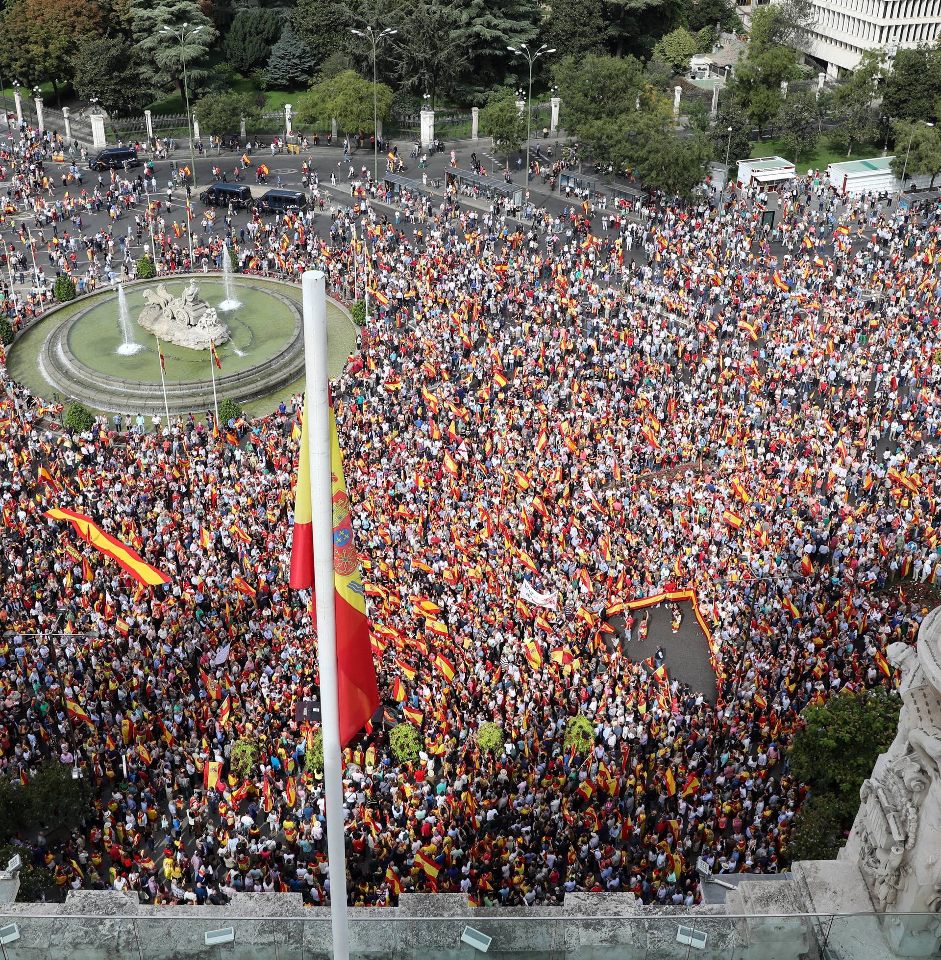 Demonstrators gather in front of city hall during a demonstration in favor of a unified Spain a day before the banned October 1 independence referendum, in Madrid
