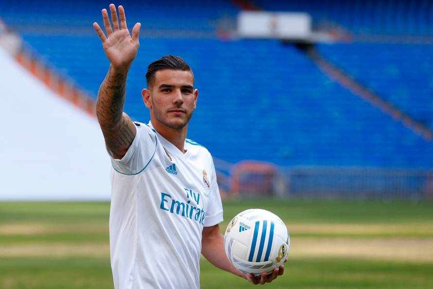 Real Madrid's new player Theo Hernandez waves during his presentation at the Santiago Bernabeu Stadium in Madrid