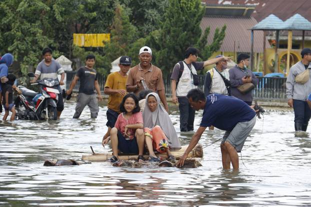 Deadly floods and landslides in Indonesia leave hundreds dead and missing