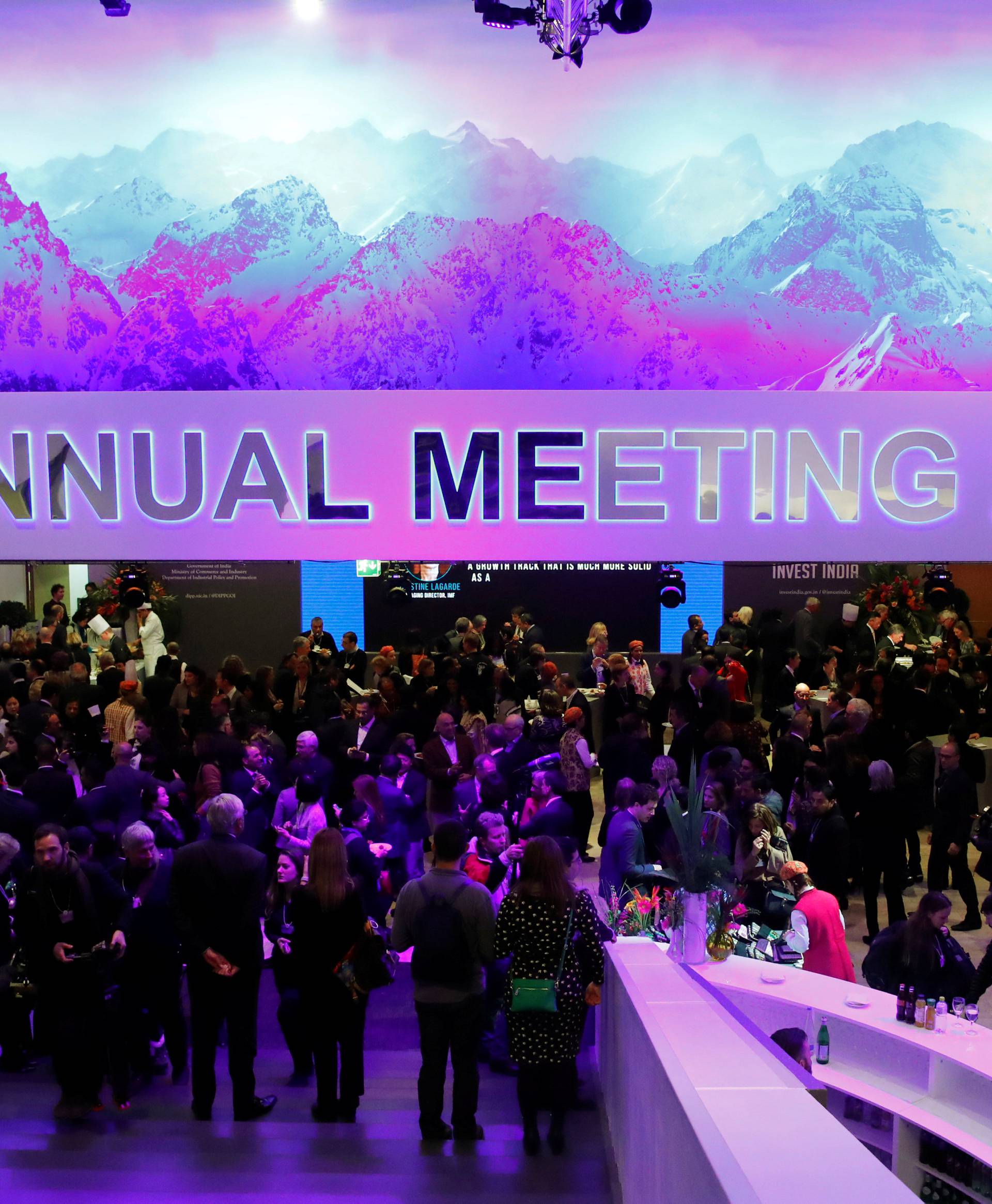Attendees take part at a reception event after the Crystal Award ceremony during the World Economic Forum (WEF) annual meeting in Davos
