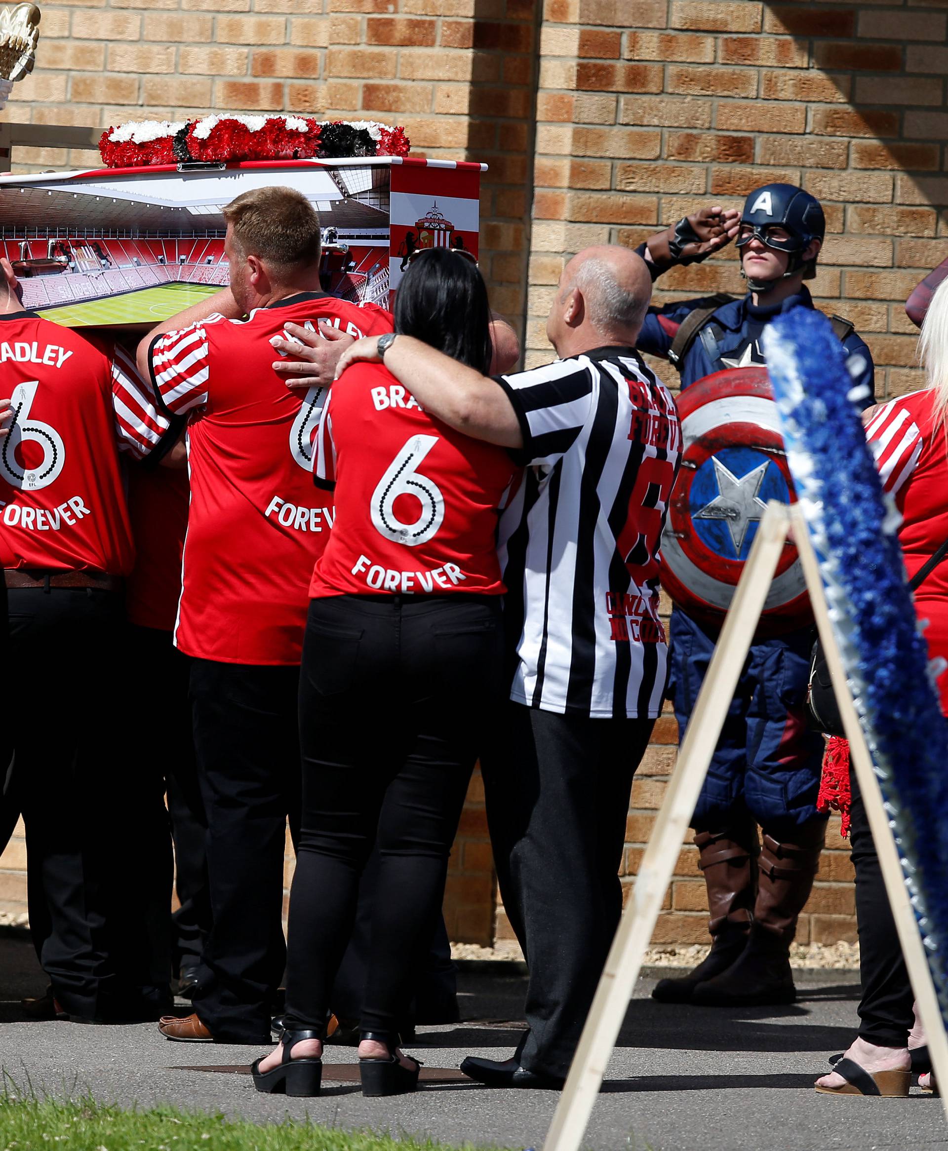 The coffin of Bradley Lowery is lifted from a carriage ahead of his funeral
