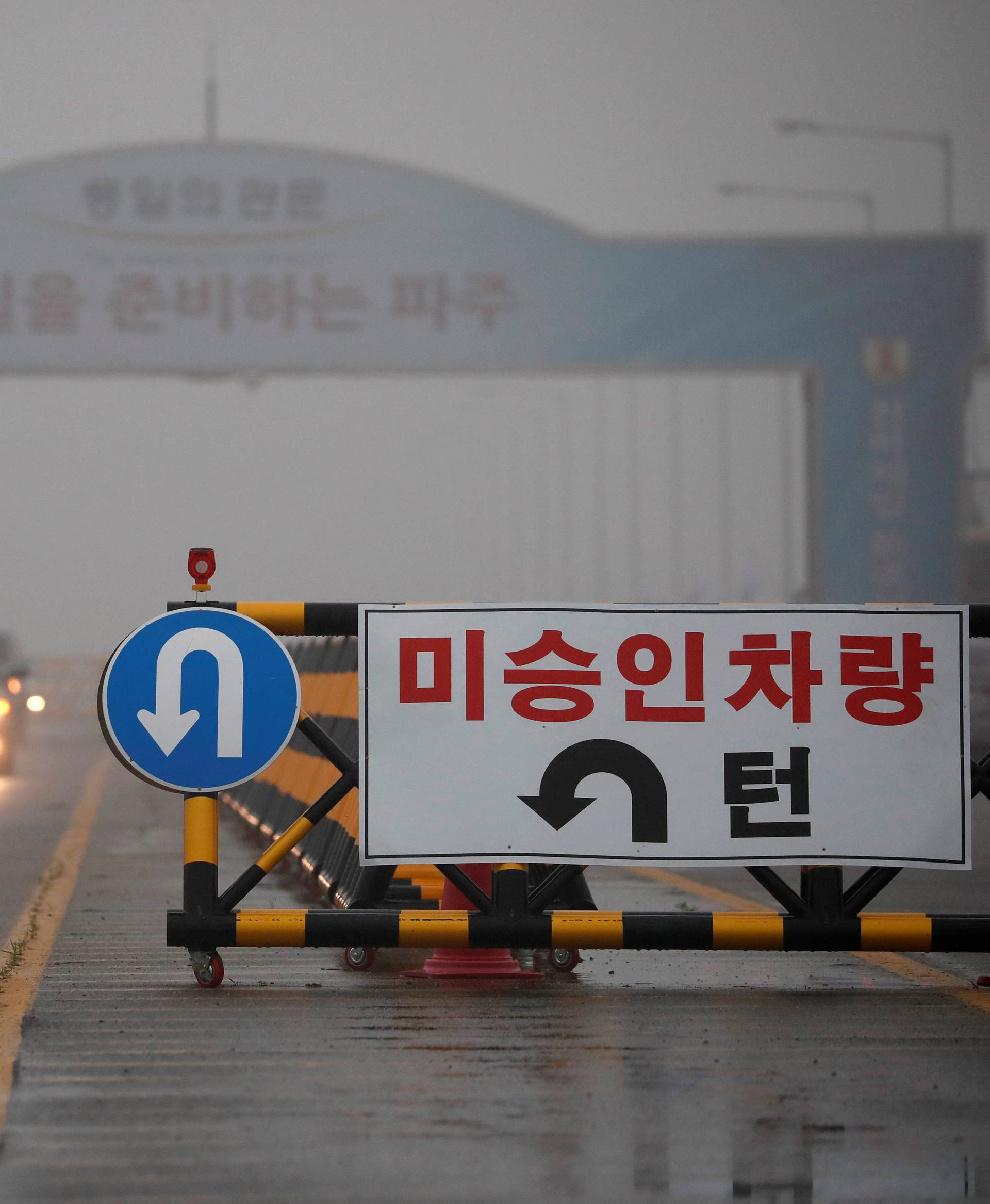 A traffic sign is seen on the Grand Unification Bridge which leads to the truce village Panmunjom, just south of the demilitarized zone separating the two Koreas, in Paju