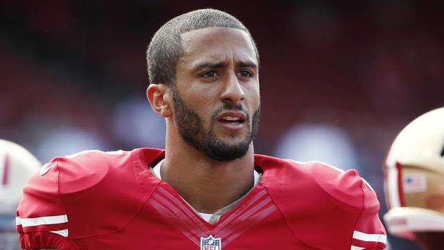 San Francisco 49ers' Kaepernick stands on the field before their NFL pre-season football game against Denver Broncos in San Francisco