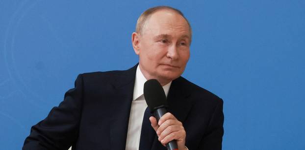 Russian President Putin delivers a lesson at Kyzyl school