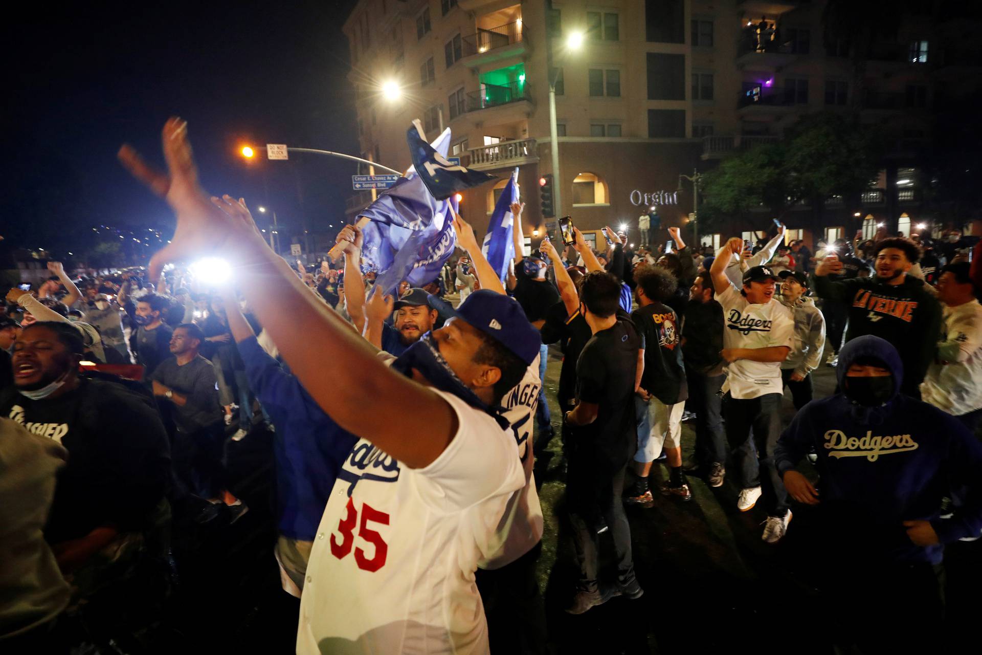 People celebrate Los Angeles Dodgers' victory at the end of game 6 of the 2020 World Series between Los Angeles Dodgers and Tampa Bay Rays, in Los Angeles, California