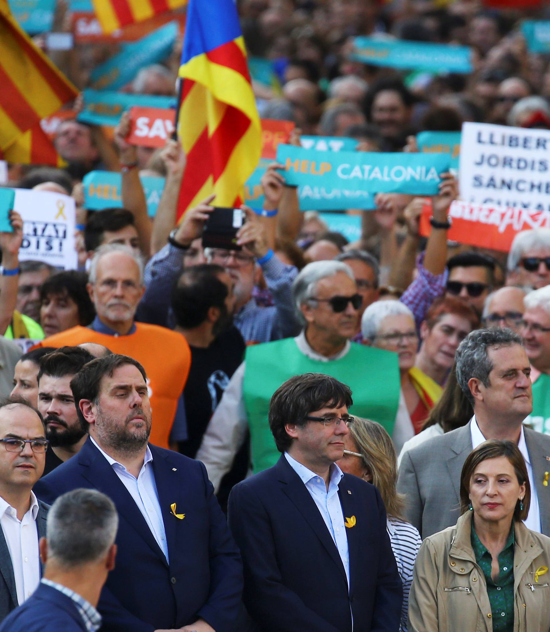 Catalan President Puigdemont and other government members attend a demonstration organised by Catalan pro-independence movements ANC (Catalan National Assembly) and Omnium Cutural, following the imprisonment of their two leaders in Barcelona