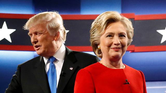 Trump and Clinton greet one another as they take the stage for their first debate at Hofstra University in Hempstead, New York, U.S.
