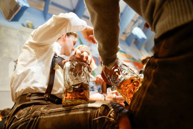 Guests celebrate the end of the 189th Oktoberfest in Munich