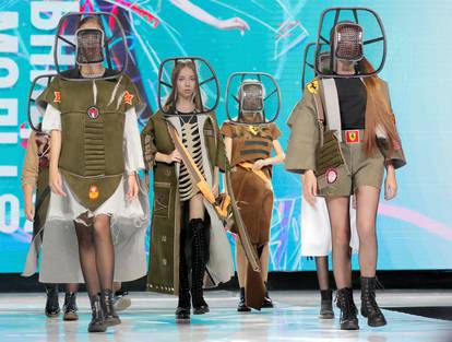 Models present creations "2033 (teens)" by Belarusian designer Kutepova during a show at the festival and contest ?Fashion Mill? in Minsk