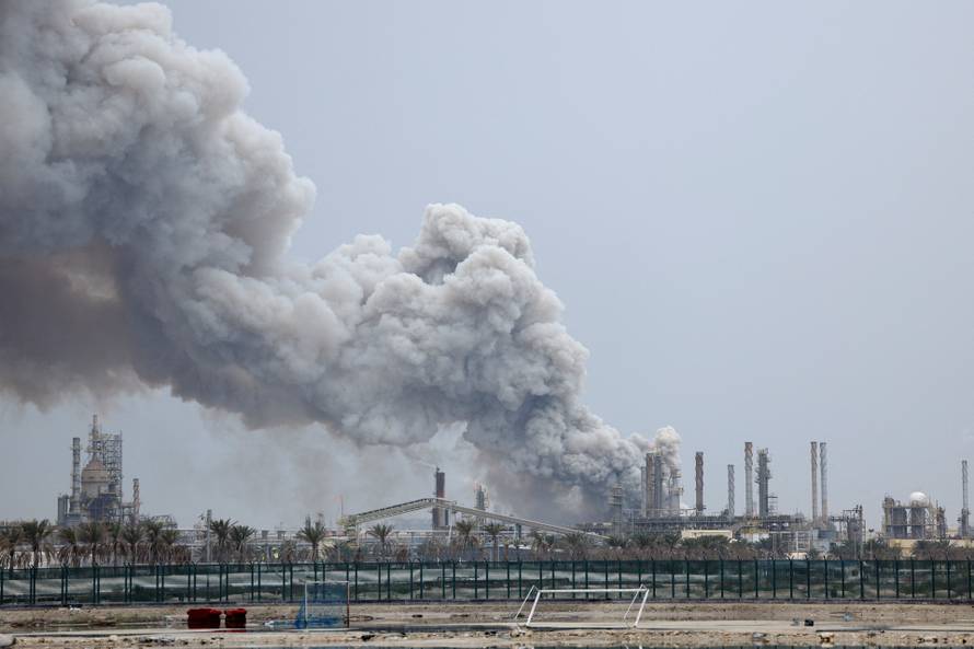 Smoke rises following a strike in Sitra Island