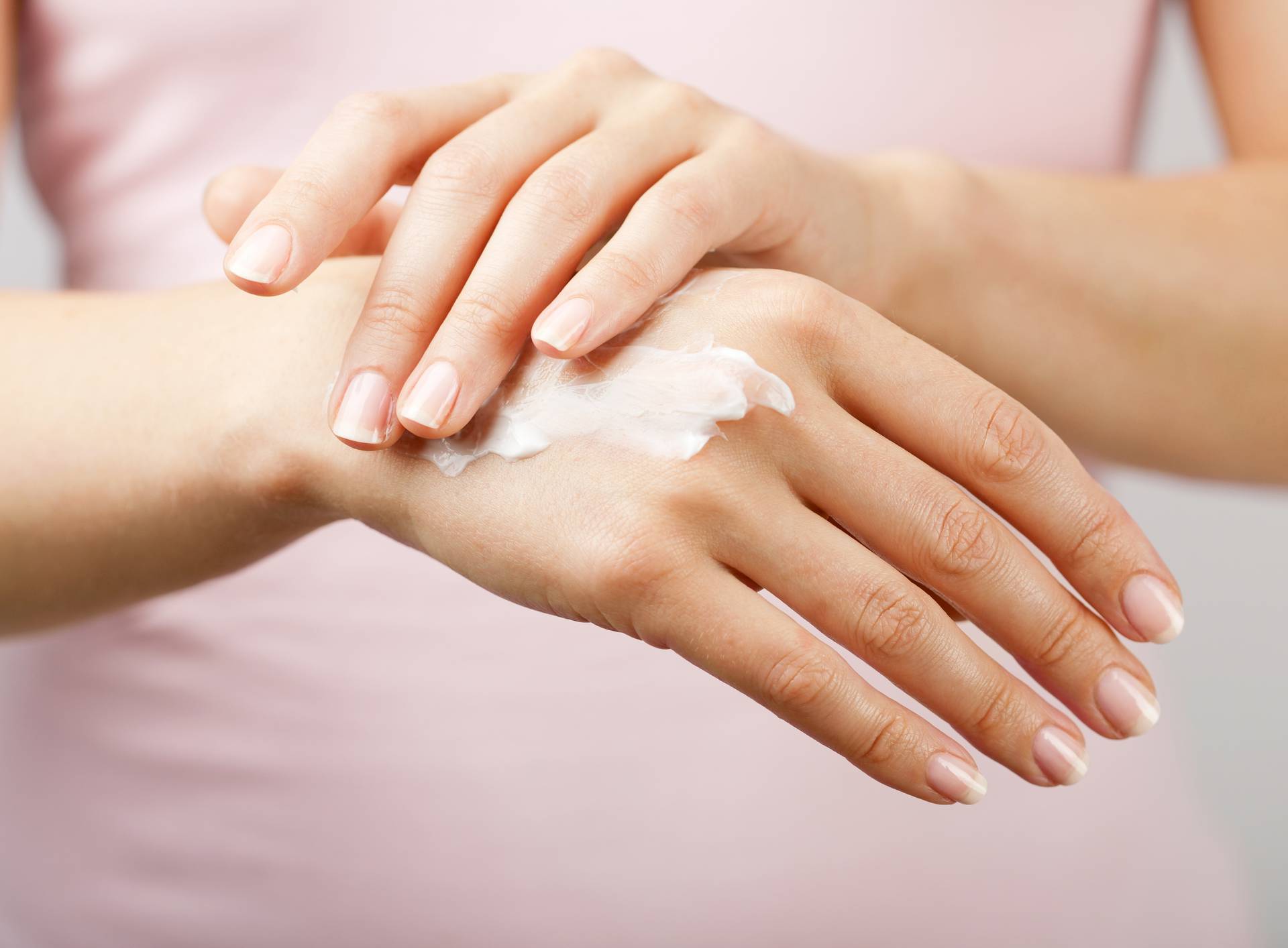 beautiful woman hands with cream 