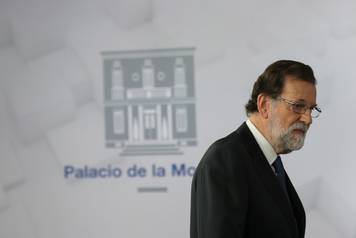 Spain's PM Rajoy arrives to deliver a statement at the Moncloa Palace in Madrid