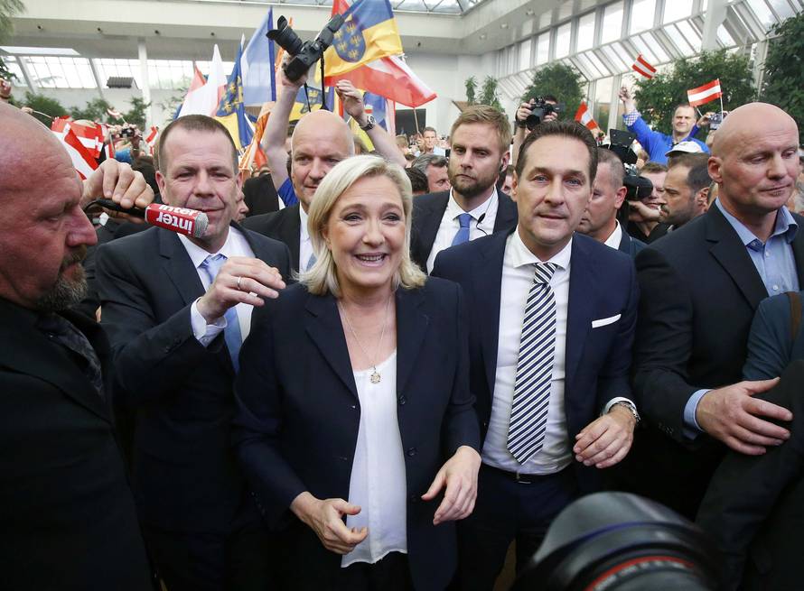 France's far right National Front political party leader Le Pen and Austrian far right FPOe leader Strache arrive at the "Public Meeting on Patriotic Spring" in Vienna