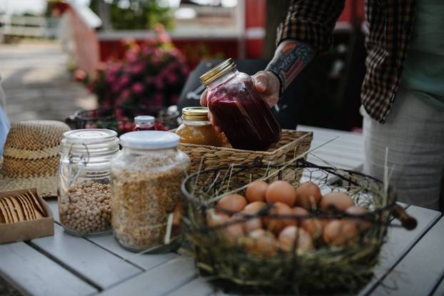 Close,Up,Of,Man,Buying,Organic,Juice,Outdoors,At,Local