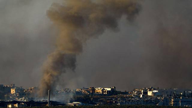 Smoke rises above Gaza, as seen from Southern Israel