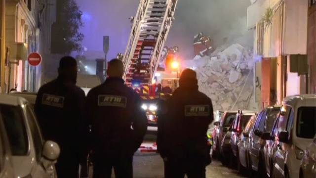 Firefighters work after a building collapsed in Marseille