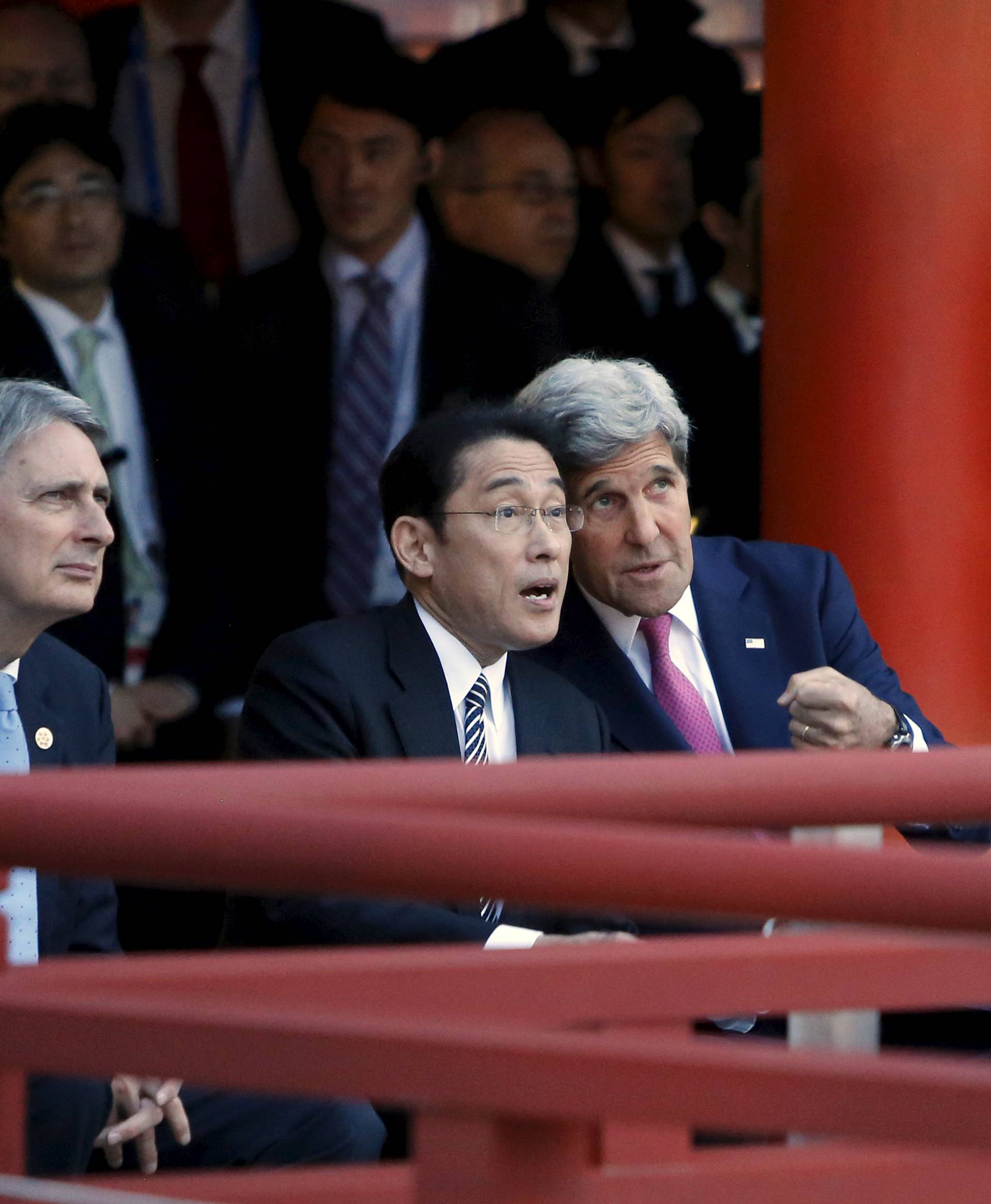 Kerry talks to Kishida during a ceremonial dance at the Itsukushima Shrine, as they and Hammond and Gentiloni take a cultural break from their G7 foreign minister meetings in nearby Hiroshima to visit Miyajima Island