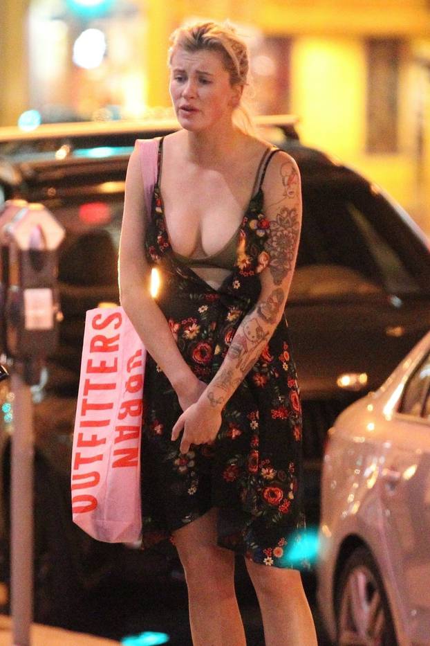 *EXCLUSIVE* Ireland Baldwin appears to argue with unidentified guy on late night outside of Rock & Reillyâs