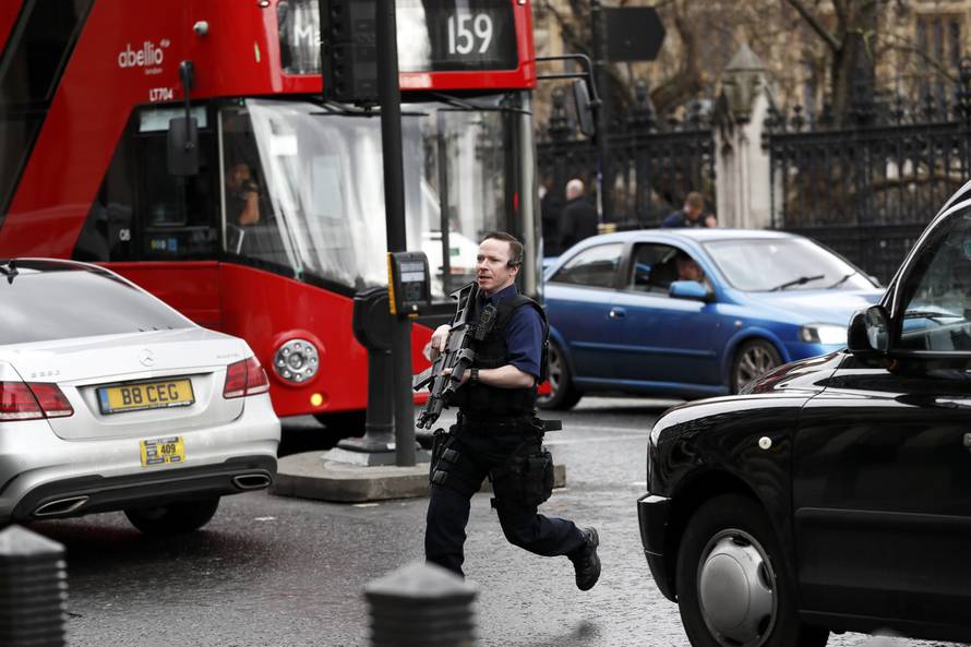 Armed police respond outside Parliament during an incident on Westminster Bridge in London