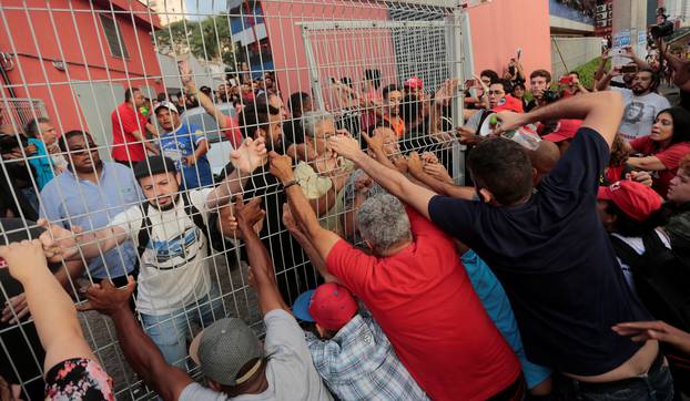 Supporters of former Brazilian President Luiz Inacio Lula da Silva block the way out as Lula tries to leave the metallurgic trade union in Sao Bernardo do Campo