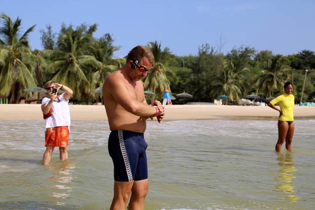 Ben Hooper, 38, adjusts his watch before starting a swim across the Atlantic from Dakar