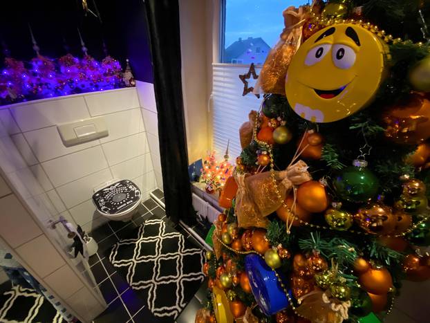 A couple in the German town of Rinteln wins the world record title with their 444 Christmas trees in one home