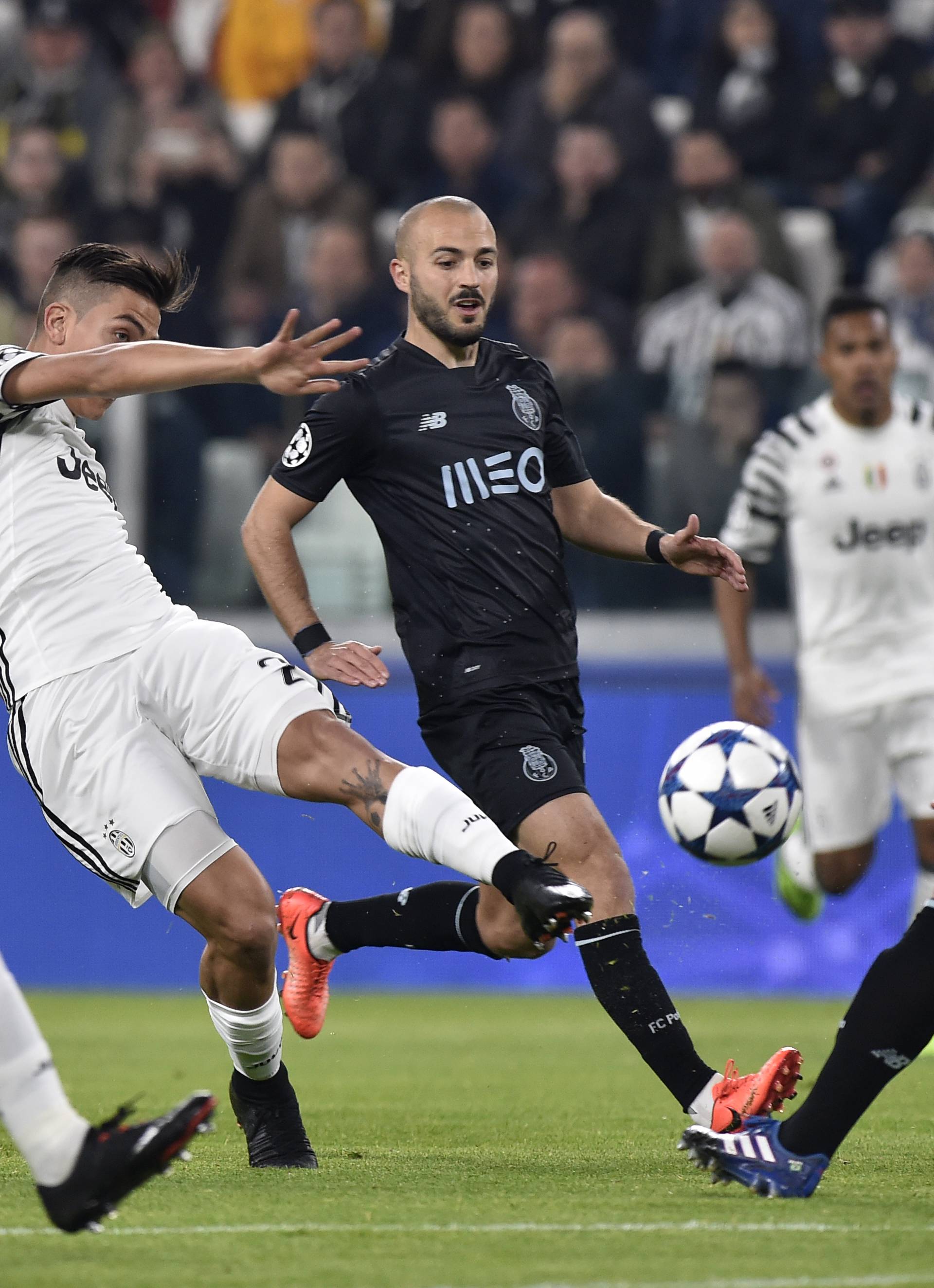 Juventus' Paulo Dybala shoots at goal