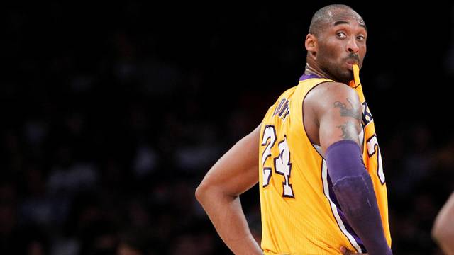 FILE PHOTO: Los Angeles Lakers' Bryant chews on his jersey during NBA game in Los Angeles