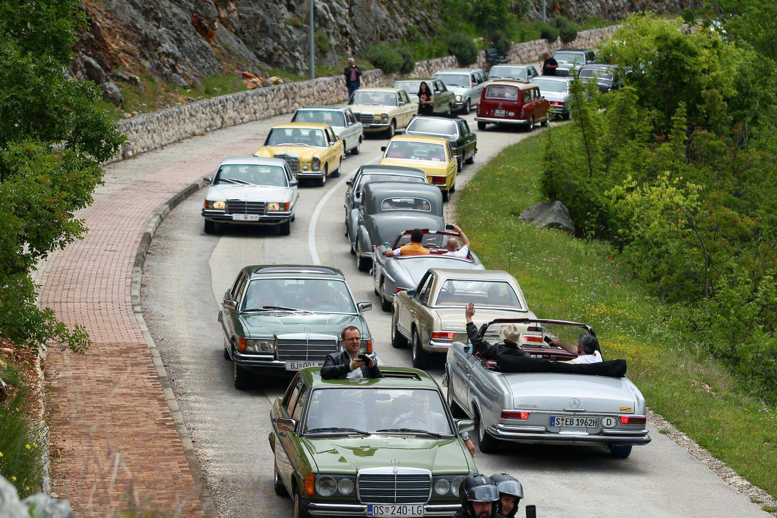 Old-timer Mercedes cars are seen driving in Imotski