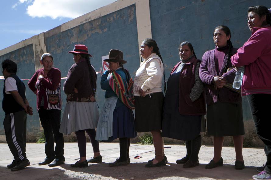 People wait on line to vote at a polling station during presidential election in Cuzco