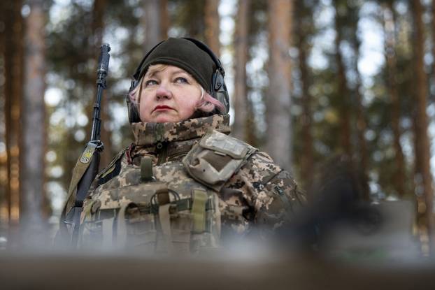 Witches of Bucha, a group of female volunteer soldiers, undergo tactical shooting training in Kyiv - 08 Feb 2025