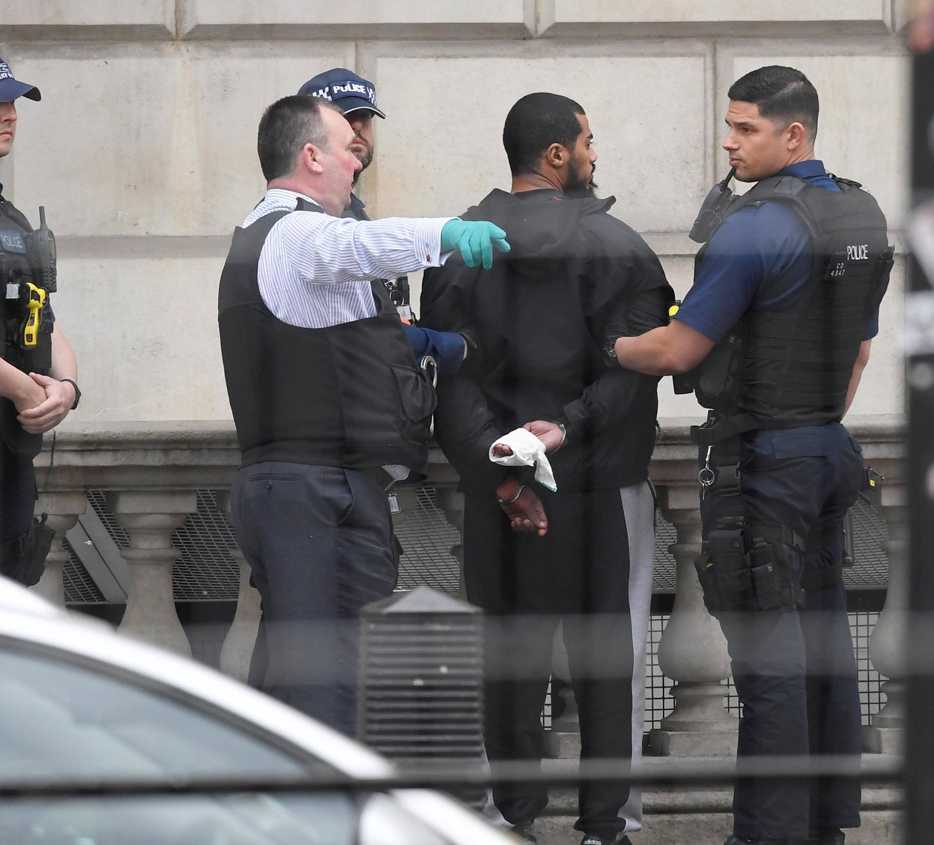 A man is held by police in Westminster after an arrest was made on Whitehall in central London