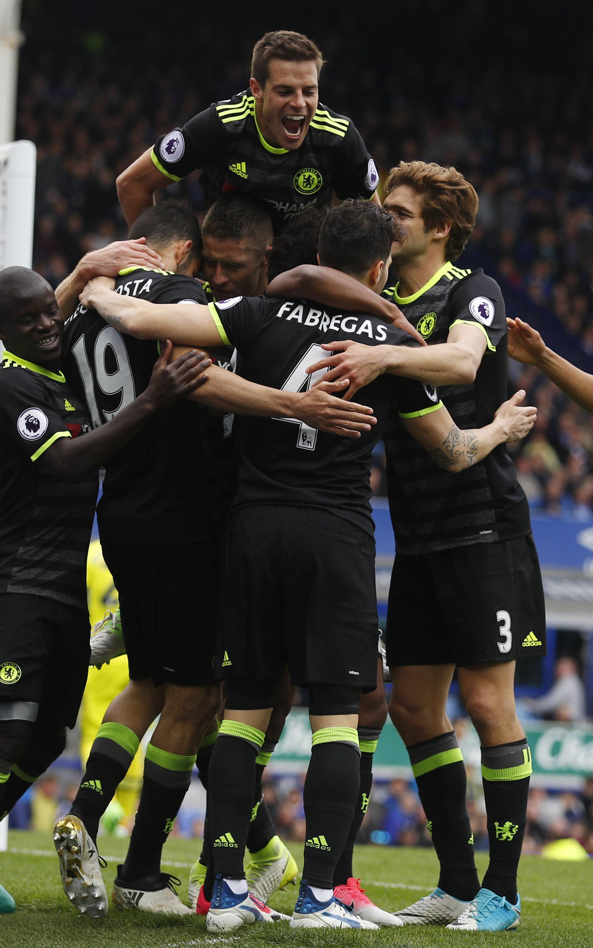 Chelsea's Willian celebrates scoring their third goal with  Cesar Azpilicueta and teammates