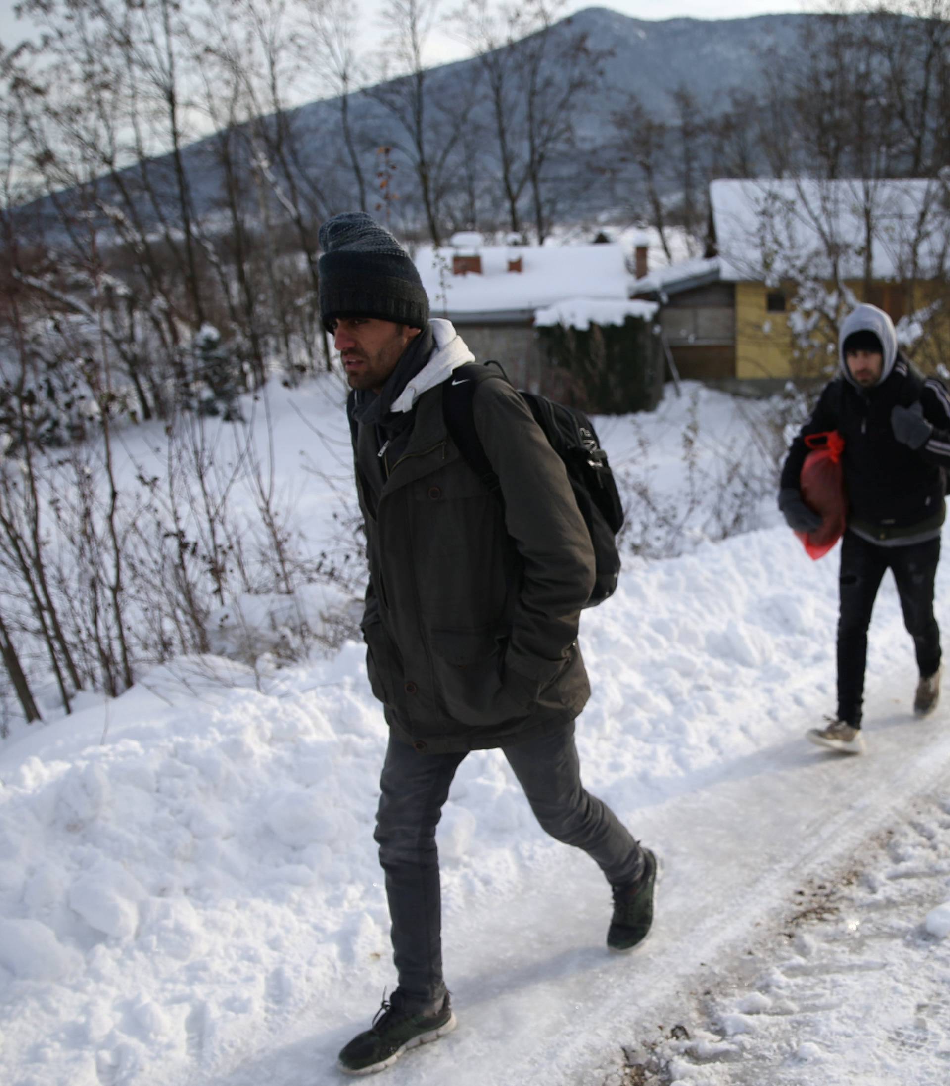 A group of migrants attempts to illegally cross the border into Croatia on the Pljesevica Mountain near Bihac