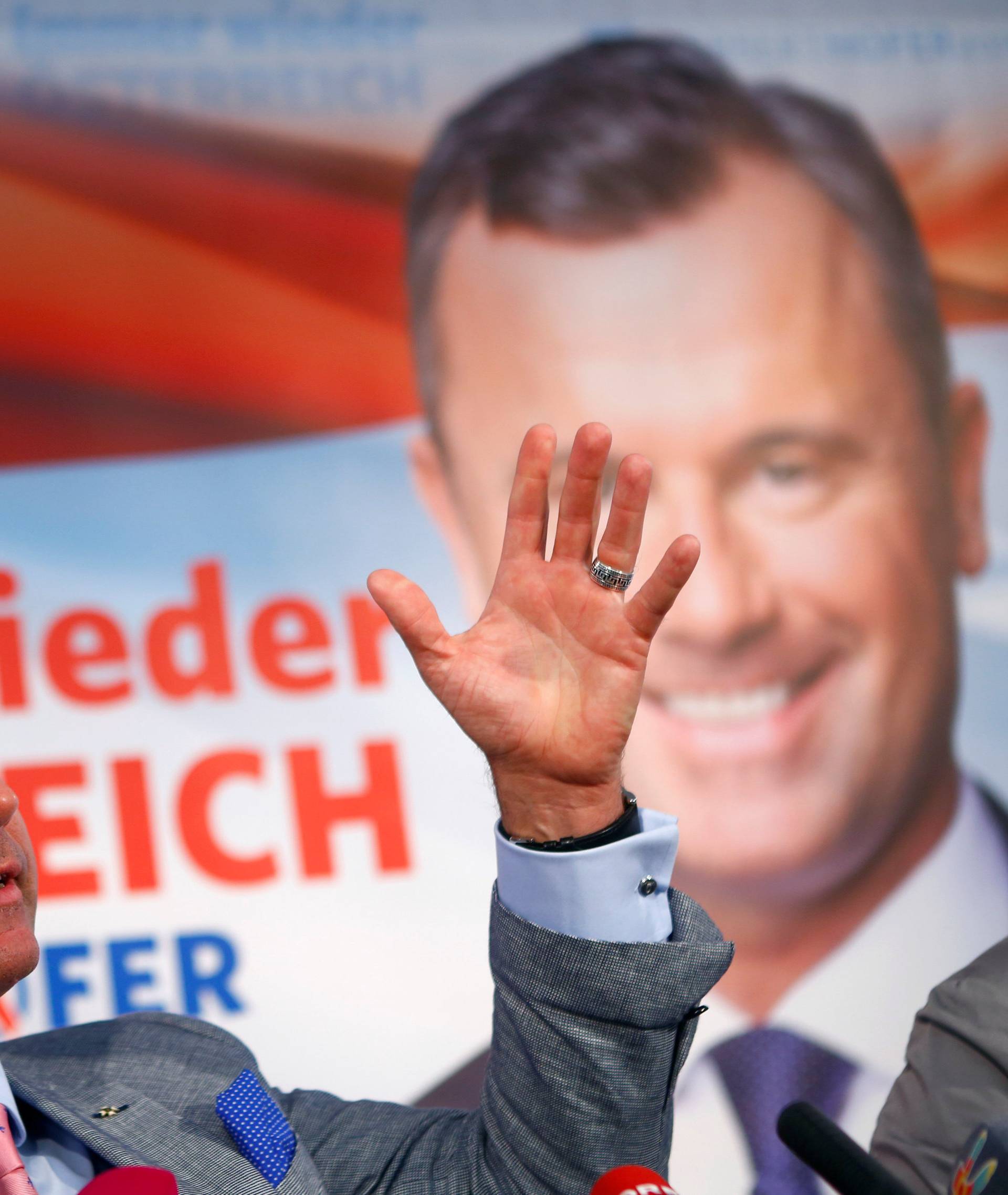 Austrian far right Freedom Party presidential candidate Hofer addresses a news conference in Vienna