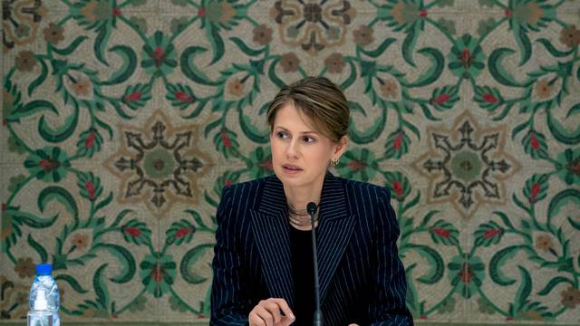 FILE PHOTO: Asma al-Assad, wife of Syrian President Bashar al-Assad, meets with humanitarian and business groups in Damascus