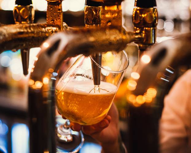 Ice,Cold,Beer,Being,Poured,In,A,Local,Restaurant