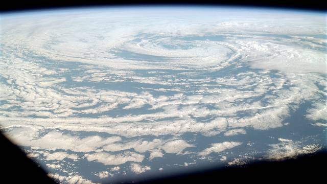 A cyclonic storm system north of Hawaii as seen from Apollo 9