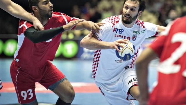 Habib Mohamed of Bahrain and Igor Karaci of Croatia in action during their men's handball Olympic qualification match in Boxen